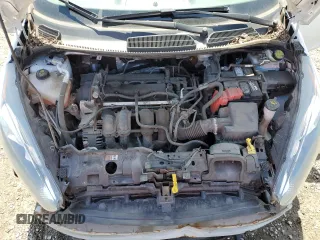 2018 Ford Fiesta SE z VIN 3FADP4BJ7JM114172, wystawiony jako Copart lot #54014805 z przebiegiem 66 828 mil mil oraz Szkoda całkowita • Salvage title. Historia ofert i sprzedaży dostępna na DreamBid. Obrazek 11.
