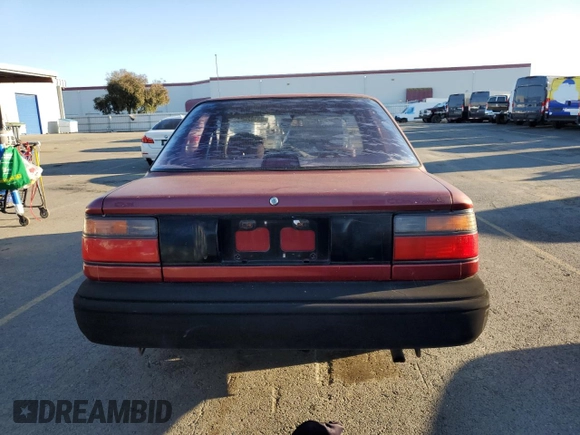 1989 Toyota Corolla with VIN JT2AE92E4K0112945, listed as a Copart auction lot 83382604 with 209,462 mi miles and Salvage title. Bid and sale history available at DreamBid. Image 6.