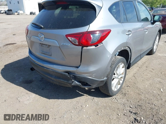 2014 Mazda CX-5 Grand Touring with VIN JM3KE4DY7E0311893, listed as a IAAI auction lot 42090872 with 102,154 mi miles and . Bid and sale history available at DreamBid. Image 17.