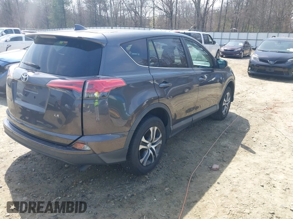 2017 Toyota RAV4 LE with VIN 2T3ZFREV9HW390859, listed as a IAAI auction lot 41802727 with 167,085 mi miles and . Bid and sale history available at carsss.com. Image 4.