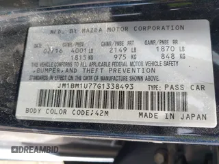 2016 Mazda 3 i Sport with VIN JM1BM1U77G1338493, listed as a IAAI auction lot 41990820 with 155,339 mi miles and . Bid and sale history available at carsss.com. Image 9.