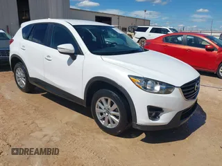2016 Mazda CX-5 Touring z VIN JM3KE2CY0G0840918, wystawiony jako IAAI lot #42205529 z przebiegiem 74 515 mil mil oraz . Historia ofert i sprzedaży dostępna na DreamBid. Obrazek 1.