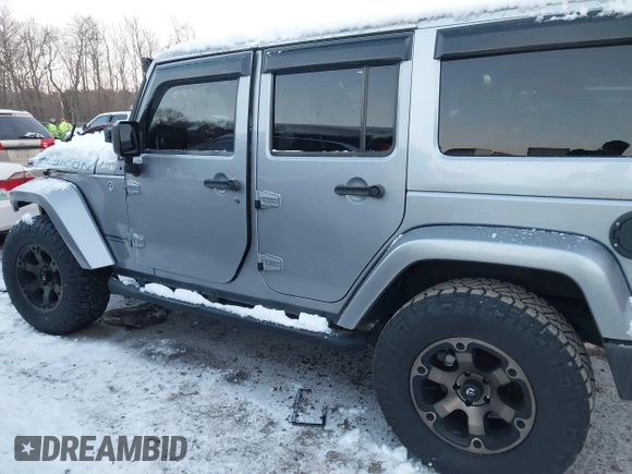 2015 Jeep Wrangler Unlimited Rubicon Hard Rock with VIN 1C4HJWFG1FL659803, listed as a IAAI auction lot 41172485 with 126,881 mi miles and . Bid and sale history available at DreamBid. Image 14.
