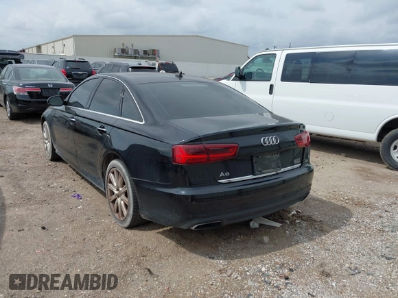 2016 Audi A6 2.0T Premium Plus with VIN WAUGFAFC1GN012799, listed as a IAAI auction lot 42141346 with 101,506 mi miles. Bid and sale history available at carsss.com. Image 3.