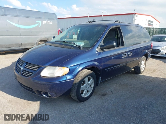 2005 Dodge Caravan SXT with VIN 2D4GP44L65R565519, listed as a IAAI auction lot 42730269 with 124,848 mi miles and . Bid and sale history available at DreamBid. Image 2.
