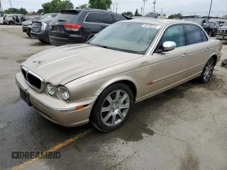 2004 Jaguar XJ with VIN SAJEA74C84SG03857, listed as a Copart auction lot 62156875 with 92,649 mi miles and Salvage title. Bid and sale history available at DreamBid. Image 1.