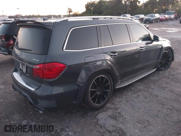 2014 Mercedes-Benz GL-Class GL 550 with VIN 4JGDF7DE9EA329761, listed as a IAAI auction lot 41651533 with 113,056 mi miles. Bid and sale history available at carsss.com. Image 4.