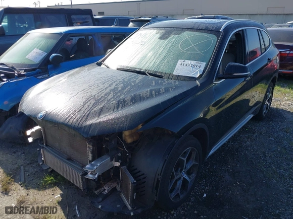 2018 BMW X1 sDrive28i with VIN WBXHU7C39J5L07129, listed as a IAAI auction lot 41472014 with 56,486 mi miles. Bid and sale history available at carsss.com. Image 2.
