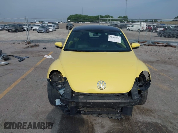 2013 Volkswagen Beetle with VIN 3VWHX7AT0DM603661, listed as a IAAI auction lot 42464030 with 95,159 mi miles and . Bid and sale history available at DreamBid. Image 6.