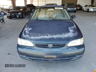 1999 Toyota Corolla VE z VIN 1NXBR12E6XZ286383, wystawiony jako Copart lot #64007215 z przebiegiem 176 069 mil mil oraz Czysty tytuł • Clean title. Historia ofert i sprzedaży dostępna na DreamBid. Obrazek 5.