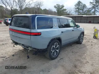 2024 Rivian R1S Adventure with VIN 7PDSGBBA1RN040036, listed as a IAAI auction lot 41694635 with 13,855 mi miles. Bid and sale history available at carsss.com. Image 4.
