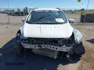 2016 Ford Escape SE with VIN 1FMCU9GX9GUC62462, listed as a IAAI auction lot 39999808 with Not Provided miles. Bid and sale history available at carsss.com. Image 12.
