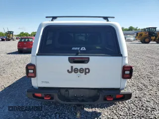 2023 Jeep Gladiator Rubicon with VIN 1C6JJTBG9PL546437, listed as a Copart auction lot 55516685 with 14,106 mi miles and Salvage title. Bid and sale history available at DreamBid. Image 6.