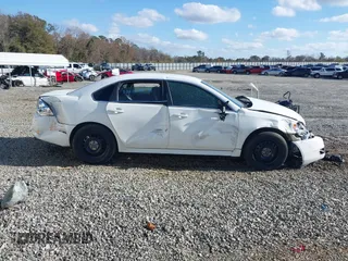 2013 Chevrolet Impala Police with VIN 2G1WD5E34D1265263, listed as a IAAI auction lot 41115415 with 191,679 mi miles. Bid and sale history available at carsss.com. Image 13.