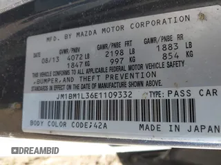 2014 Mazda 3 S Touring with VIN JM1BM1L36E1109332, listed as a IAAI auction lot 41635456 with 180,146 mi miles and . Bid and sale history available at DreamBid. Image 9.