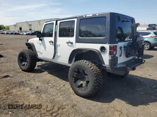 2013 Jeep Wrangler Unlimited Rubicon with VIN 1C4HJWFG2DL549064, listed as a Copart auction lot 56474055 with 148,217 mi miles and Salvage title. Bid and sale history available at DreamBid. Image 2.