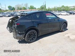 2023 Tesla Model Y Long Range with VIN 7SAYGDEE0PA111430, listed as a IAAI auction lot 42156924 with 35,950 mi miles and . Bid and sale history available at DreamBid. Image 4.