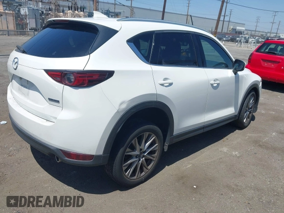 2020 Mazda CX-5 Grand Touring with VIN JM3KFADM9L0821930, listed as a IAAI auction lot 42549986 with 29,929 mi miles and . Bid and sale history available at DreamBid. Image 4.