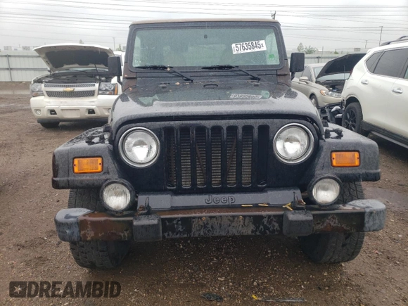 2000 Jeep Wrangler Sahara z VIN 1J4FA59S2YP714136, wystawiony jako Copart lot #57635845 z przebiegiem 178 075 mil mil oraz Czysty tytuł • Clean title. Historia ofert i sprzedaży dostępna na DreamBid. Obrazek 5.