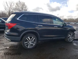 2017 Honda Pilot Touring with VIN 5FNYF6H90HB028112, listed as a Copart auction lot 52197645 with 218,944 mi miles and Salvage Title. Bid and sale history available at DreamBid. Image 3.