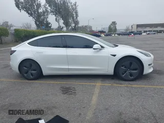 2020 Tesla Model 3 Long Range with VIN 5YJ3E1EB0LF803217, listed as a IAAI auction lot 41871940 with 130,391 mi miles. Bid and sale history available at carsss.com. Image 13.