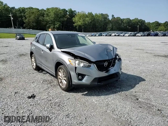 2015 Mazda CX-5 Grand Touring with VIN JM3KE4DY8F0540181, listed as a Copart auction lot 70624394 with 119,420 mi miles and Salvage Title. Bid and sale history available at carsss.com. Image 12.