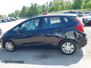 2015 Honda Fit LX z VIN 3HGGK5H51FM724566, wystawiony jako IAAI lot #42151755 z przebiegiem 168 744 mil mil oraz . Historia ofert i sprzedaży dostępna na DreamBid. Obrazek 14.