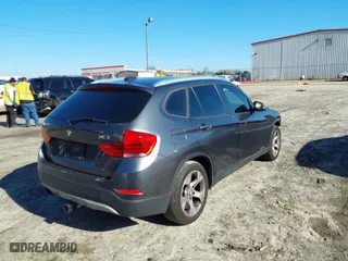 2014 BMW X1 sDrive28i with VIN WBAVM1C51EVW49093, listed as a IAAI auction lot 41500647 with 111,036 mi miles. Bid and sale history available at carsss.com. Image 4.