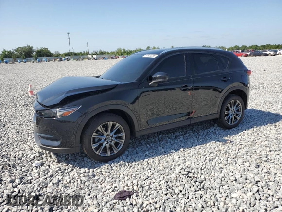 2021 Mazda CX-5 Signature with VIN JM3KFBEY5M0439676, listed as a Copart auction lot 52823285 with 41,811 mi miles and Non Repairable. Bid and sale history available at carsss.com. Image 1.