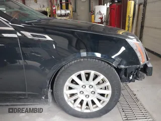 2011 Cadillac CTS Luxury with VIN 1G6DG5EYXB0145058, listed as a IAAI auction lot 41973156 with 143,246 mi miles and . Bid and sale history available at carsss.com. Image 13.