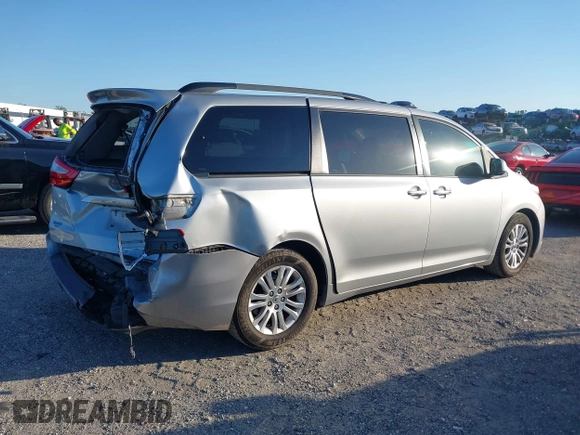 2015 Toyota Sienna XLE with VIN 5TDYK3DC9FS610925, listed as a IAAI auction lot 42022267 with 153,997 mi miles. Bid and sale history available at carsss.com. Image 4.
