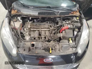 2019 Ford Fiesta SE z VIN 3FADP4BJ9KM151046, wystawiony jako Copart lot #56862255 z przebiegiem 77 002 mil mil oraz Tytuł czysty. Historia ofert i sprzedaży dostępna na DreamBid. Obrazek 11.