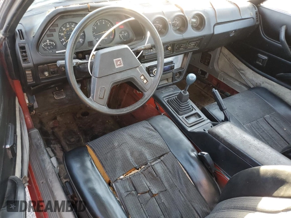 1983 Datsun 280ZX z VIN JN1HZ04S0DX569855, wystawiony jako Copart lot #74027594 z przebiegiem 12 300 mil mil oraz Szkody całkowita. Historia ofert i sprzedaży dostępna na DreamBid. Obrazek 8.