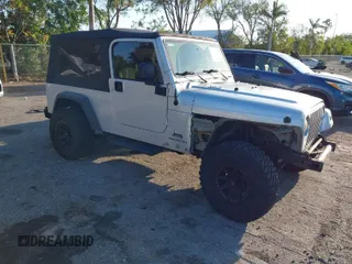 2005 Jeep Wrangler Unlimited with VIN 1J4FA44S65P335444, listed as a IAAI auction lot 41731093 with 143,918 mi miles. Bid and sale history available at carsss.com. Image 1.