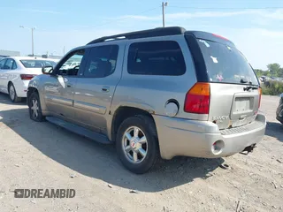 2003 GMC Envoy SLT with VIN 1GKES16S336101568, listed as a IAAI auction lot 40187998 with 185,402 mi miles. Bid and sale history available at carsss.com. Image 3.