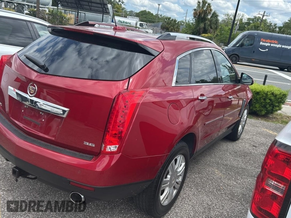 2015 Cadillac SRX Luxury Collection z VIN 3GYFNBE37FS569840, wystawiony jako Copart lot #52823025 z przebiegiem 183 816 mil mil oraz Czysty tytuł • Clean title. Historia ofert i sprzedaży dostępna na DreamBid. Obrazek 4.