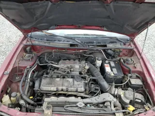 1990 Mazda Protege z VIN JM1BG2246L0167483, wystawiony jako Copart lot #48603295 z przebiegiem 170 461 mil mil oraz Czysty tytuł • Clean title. Historia ofert i sprzedaży dostępna na DreamBid. Obrazek 11.