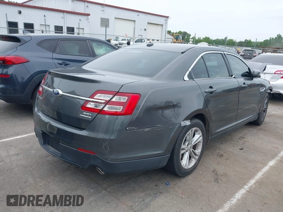 2015 Ford Taurus SEL with VIN 1FAHP2E81FG163058, listed as a IAAI auction lot 42221098 with 127,957 mi miles and . Bid and sale history available at carsss.com. Image 4.