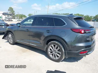 2020 Mazda CX-9 Grand Touring z VIN JM3TCADY8L0417775, wystawiony jako IAAI lot #42306864 z przebiegiem 35 287 mil mil oraz . Historia ofert i sprzedaży dostępna na DreamBid. Obrazek 3.