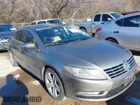 2014 Volkswagen CC Sport with VIN WVWBN7AN1EE518559, listed as a IAAI auction lot 41208853 with 154,957 mi miles. Bid and sale history available at carsss.com. Image 1.