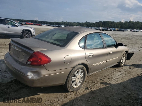 2003 Ford Taurus SEL Deluxe with VIN 1FAHP56SX3A243775, listed as a Copart auction lot 72245394 with 251,041 mi miles and Salvage Title. Bid and sale history available at DreamBid. Image 3.