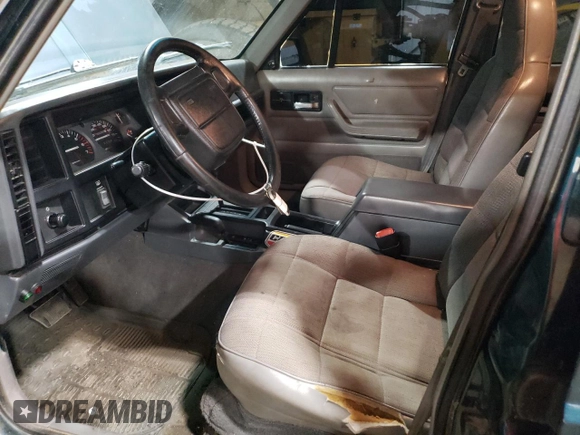 1996 Jeep Cherokee Sport with VIN 1J4FJ68S1TL226495, listed as a Copart auction lot 58587685 with 205,397 mi miles and Salvage title. Bid and sale history available at DreamBid. Image 7.