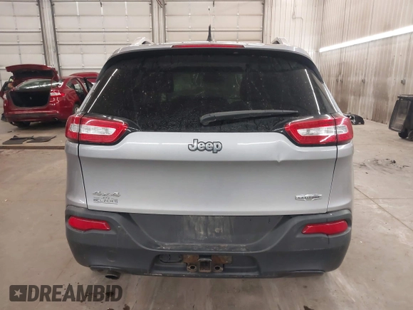 2014 Jeep Cherokee Altitude with VIN 1C4PJMCB9EW149754, listed as a IAAI auction lot 41983427 with 199,810 mi miles and . Bid and sale history available at DreamBid. Image 17.