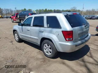 2010 Jeep Grand Cherokee Laredo with VIN 1J4PR4GKXAC141526, listed as a IAAI auction lot 41997559 with 0 mi miles. Bid and sale history available at carsss.com. Image 3.