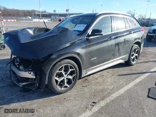 2017 BMW X1 xDrive28i with VIN WBXHT3C37H5F82992, listed as a IAAI auction lot 41293740 with 161,418 mi miles. Bid and sale history available at carsss.com. Image 2.
