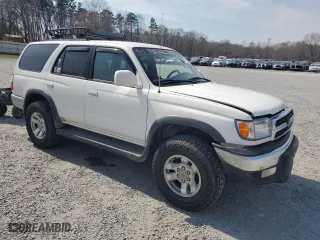 2000 Toyota 4Runner SR5 with VIN JT3HN86R5Y0286565, listed as a Copart auction lot 49271215 with 230,509 mi miles and Salvage Title. Bid and sale history available at carsss.com. Image 4.