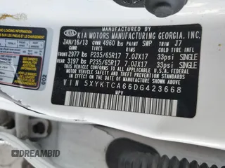2013 Kia Sorento LX z VIN 5XYKTCA66DG423668, wystawiony jako Copart lot #43718905 z przebiegiem 201 892 mil mil oraz Szkoda całkowita • Salvage title. Historia ofert i sprzedaży dostępna na DreamBid. Obrazek 13.
