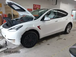 2023 Tesla Model Y Long Range with VIN 7SAYGDEE7PA100523, listed as a IAAI auction lot 40399455 with 18,885 mi miles and . Bid and sale history available at DreamBid. Image 19.