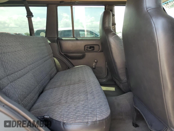 2000 Jeep Cherokee SE with VIN 1J4FF28SXYL140930, listed as a Copart auction lot 59191035 with 248,598 mi miles and Salvage title. Bid and sale history available at DreamBid. Image 11.