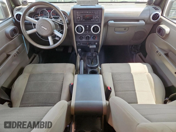 2008 Jeep Wrangler Unlimited Sahara with VIN 1J4GA59148L608970, listed as a Copart auction lot 64433495 with 134,055 mi miles and Salvage title. Bid and sale history available at DreamBid. Image 8.